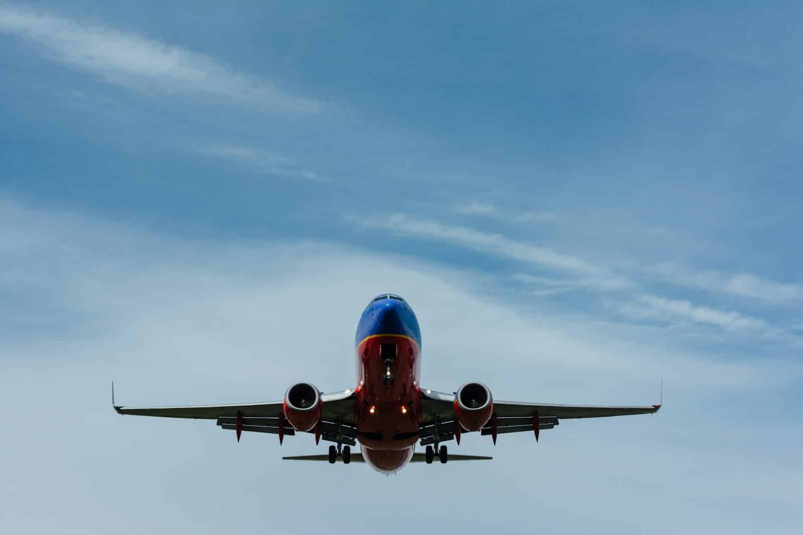 blue and red airplane on sky, can you fly with THC gummies